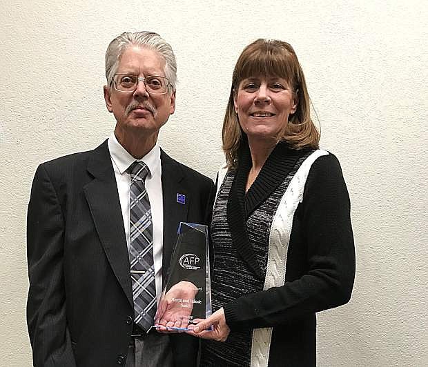 Martin T. Smith and wife Valorie accept their Outstanding Philanthropist award at this year&#039;s Cornerstone Awards banquet.