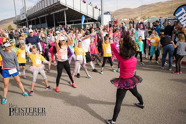 The Girls on the Run-Sierras 5K events begin with fun, complete with dance warm-ups, tutus, facepaint, and smiles all around.