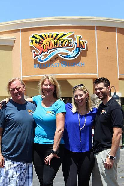 Squeeze in owners, from left, Gary and Misty Young and Shila and Chad Morris, at the opening of a franchise location in Las Vegas. The Youngs are Shila Morris&#039; parents.
