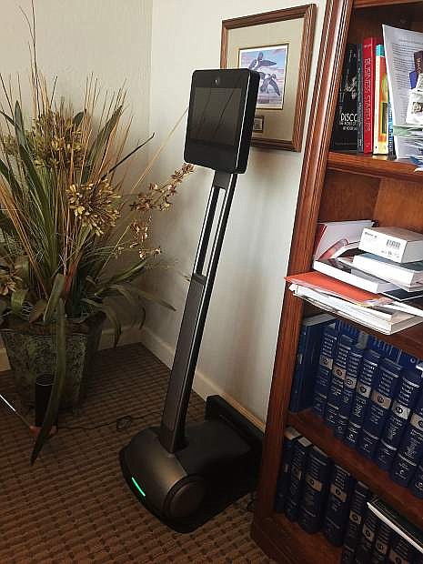 Reno attorney Gloria Petroni uses this BEAM robotic device in her office to communicate with her clients.