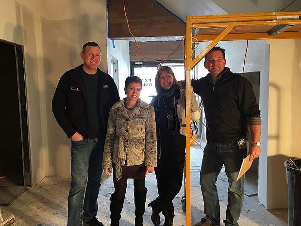 Rob McFadden, Andie Wilson, Cheryl Evans and Aaron West stand inside what will soon be the lobby of Battle Born Business Center at 1000 N. Division St.