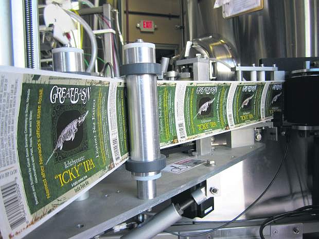 Labels for Great Basin Brewing Company&#039;s most well known beer, Ichthyosaur India Pale Ale, or &quot;Icky,&quot; rolls off a printer.