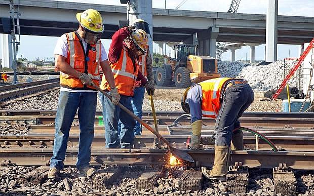 Union Pacific crew works on repairs to a railroad track.