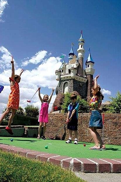 Children enjoy the outdoor miniature golf course at Coconut Bowl.
