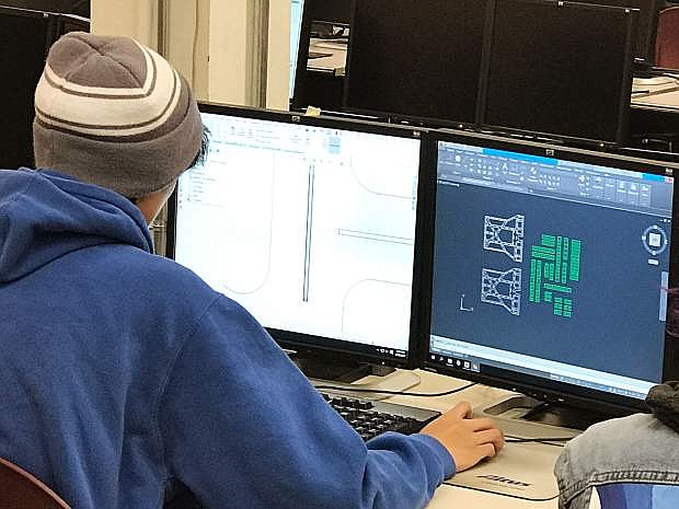 An Academy of Arts, Careers and Technology (AACT) student is using CAD software. AACT is an advanced career technical education academy within the Washoe County School District.