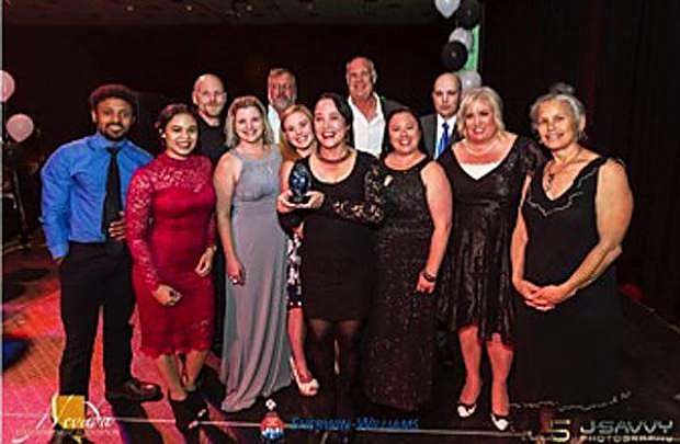 ERGS Properties staff presented with Property Management Company of the Year Award.