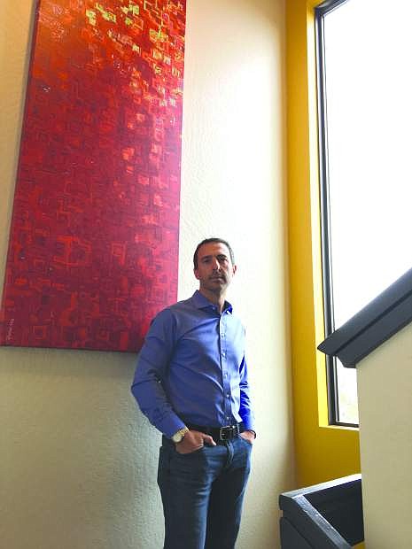 Tilio Lagatta, managing member of Blackfire Real Estate Investors, in the stairwell of the newly renovated building.