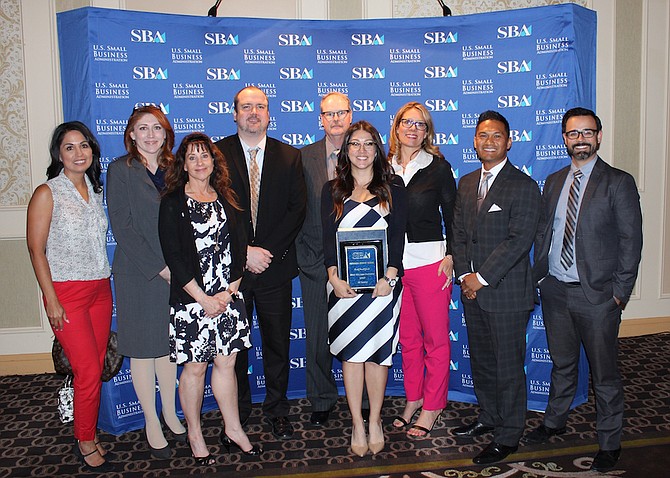 Staff with Nevada State Bank pose with the company&#039;s SBA Small Business Award after the May 4 ceremony in Las Vegas.