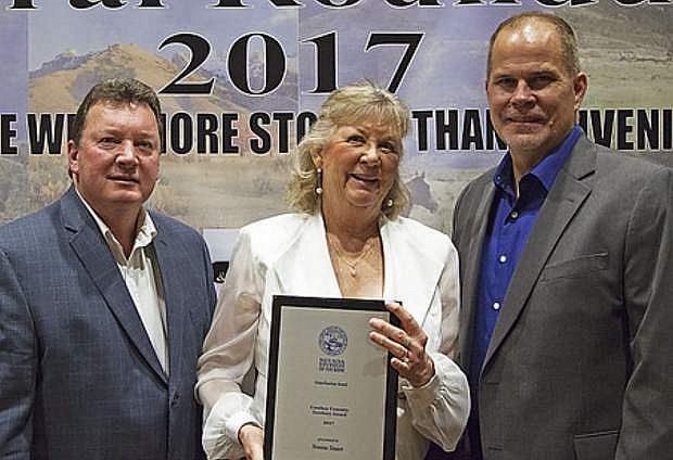 Yvonne Stuart, center, president of the Wells Chamber of Commerce, received the Cowboy Country award for her work in promoting tourism throughout Nevada&#039;s Cowboy Country Territory.