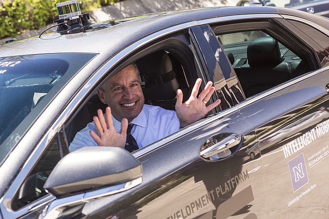 Governor Sandoval arrives to the University of Nevada, Reno campus in an autonomous vehicle Friday, June 16, 2017, demonstrating &quot;no hands&quot; needed behind the wheel.