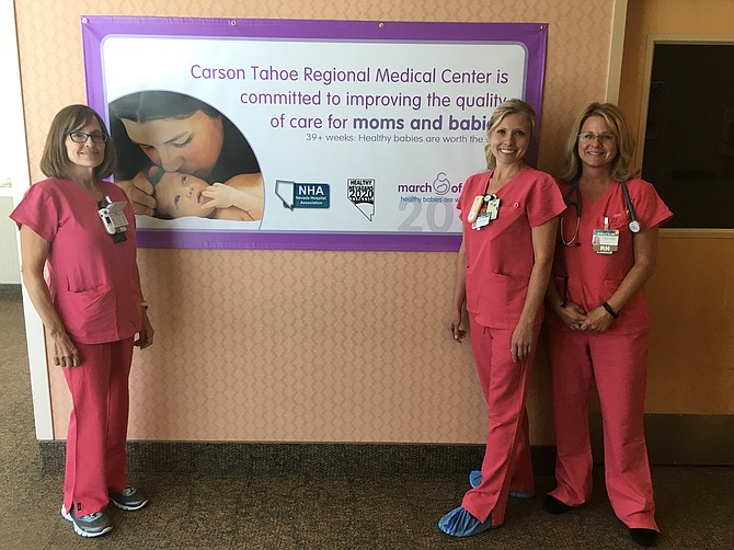 Carson Tahoe Regional Medial Center OB team members pose with the poster celebrating the hospital&#039;s recognition by March of Dimes.