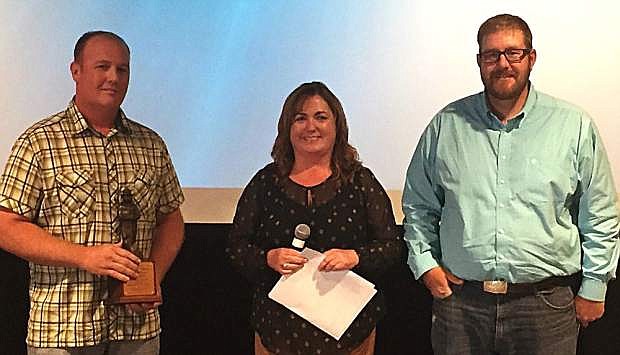 Clint Mothershead is one of 10 people nationally, who received the Bronze Smokey Bear award this year. Mothershead (left) is pictured here with Marci Todd (center), BLM Nevada Acting State Director, and Matt Murphy (right), the BLM Elko District Fuels Program Manager.