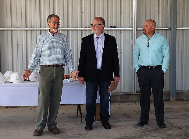From left, Bill Miles, owner of Miles Construction, introduces Richard Saute, president of Cosmetic Enterprises, at the groundbreaking ceremony along with Miles Project Manager Stacy Reid.