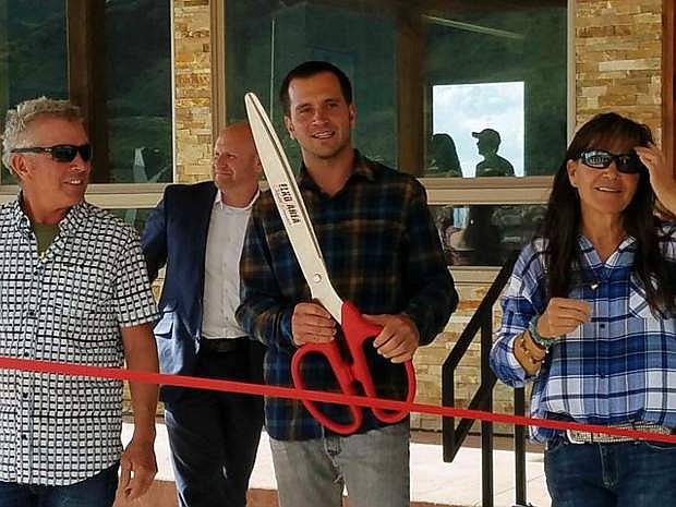 The Royer family and other officials celebrated the grand opening of the Ruby 360 Lodge outside of Lamoille, Nev. on June 1. Preparing to cut the ribbon are, from left, Joe Royer, owner operator of the lodge, Jeremy Gilpin with Greater Nevada Credit Union, Michael Royer and Francy Royer.