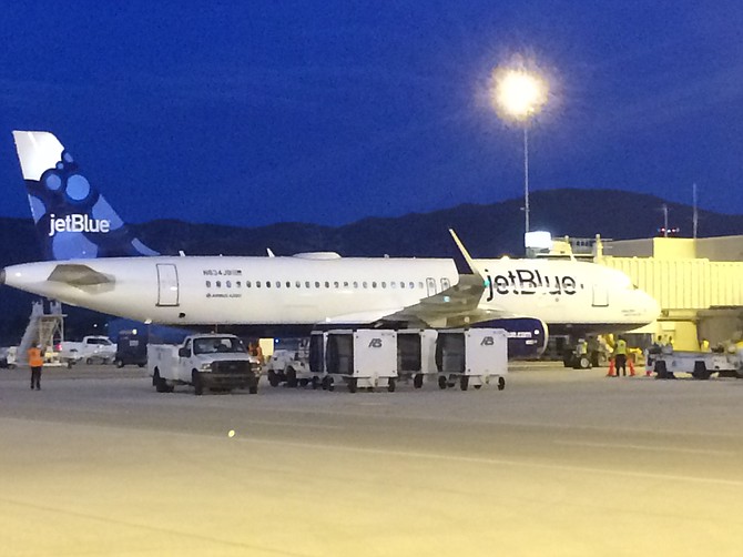 A Jet Blue aircraft prepares for boarding at the Reno-Tahoe International Airport in this file photo.