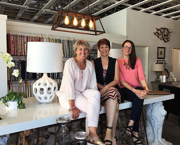 Page Campau (left), interior design professional, Charlotte Michaels, owner, and Alexandra Vaughn, operations manager at Transcend Interiors pose within their showroom in Midtown.