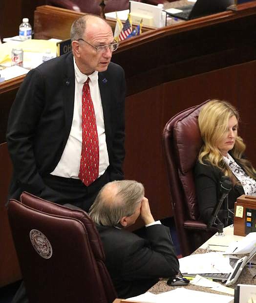 Assembly members Al Kramer, John Ellison and Melissa Woodbury wait for the evening session to begin on Monday night.