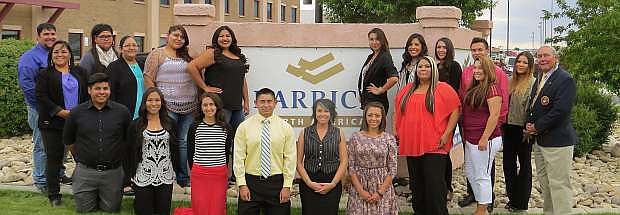 Brian Mason, far right, program manager Native American Affairs for Barrick mining and a member of the Western Shoshone Tribe, stands with tribal members who participated in an intern program sponsored by Barrick.