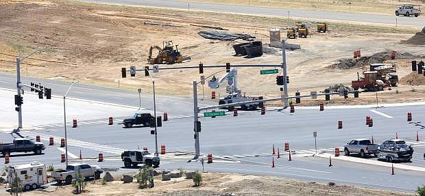 A crew works on the traffic light at the main intersection of the 580 bypass in south Carson City on Monday.
