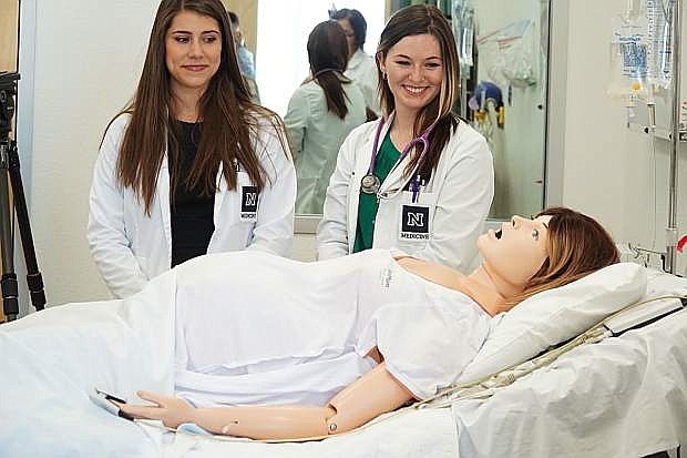 University of Nevada, Reno School of Medicine students Alexandra Magliarditi, (left) and Melissa Kelley perform a demonstration.
