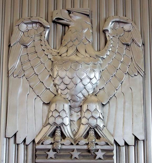 This cast aluminum eagle is one example of the archetecural detail in the historic building designed by Frederic J. DeLongchamps.