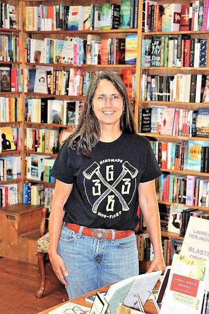 Christine Kelly, owner of Sundance Books and Music, stands in her store that has kept turning pages through recession and revolutionary changes in the industry.