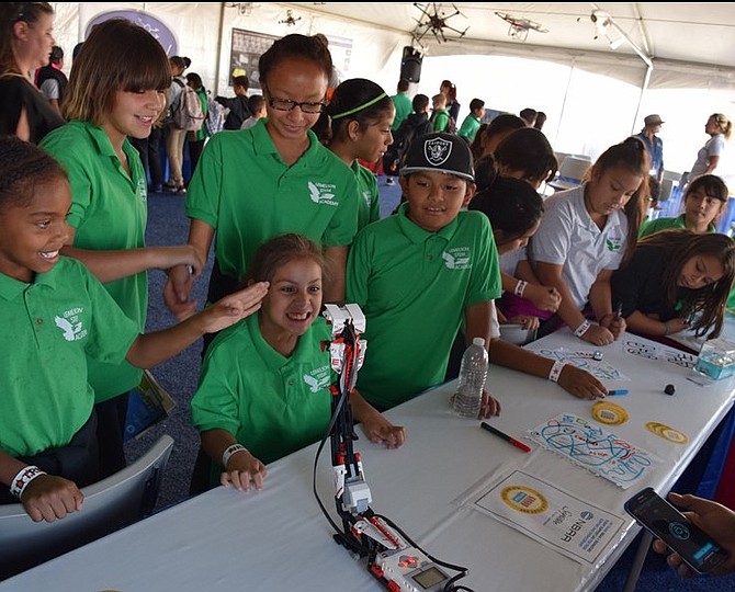 Students check out robotics during the GRADD-NVBAA Stem Education Discover Zone at the 2016 National Championship Air Races. Additional interactive STEM stations will be featured during the 2017 races.