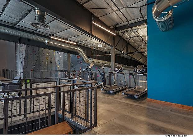 In addition to the climbing and bouldering area, the Mesa Rim Reno features a yoga studio, fitness areas with weights and cardio, locker rooms, a sauna, a gear shop, a deck, community spaces and more.