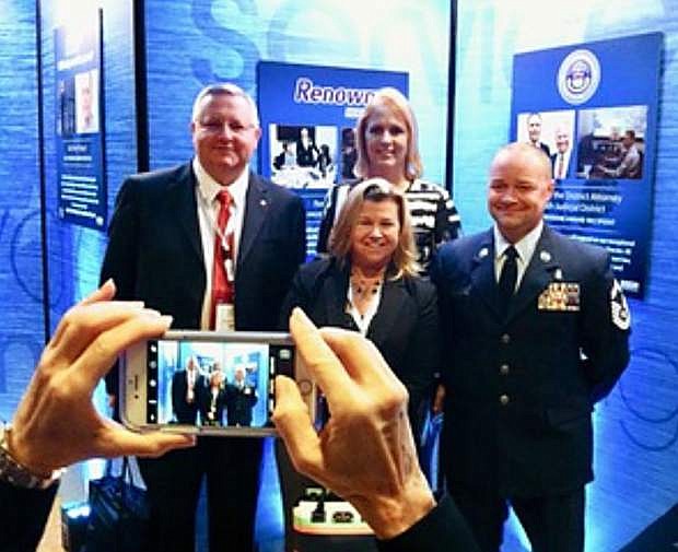 Senior Master Sgt. Jason Farnsworth with Renown Health executives Michael Henson, Michelle Sanchez-Bickley, front, and Dawn Ahner, during an awards ceremony Aug. 25 at the Pentagon.