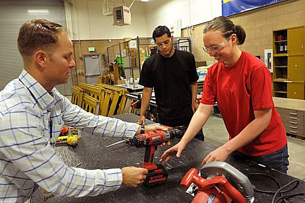 Instructor Nigel A. Harrison, left, gives instruction about hand tools to Cristian Avila and Susanne Whimple during a construction class at Western Nevada College Monday April 4, 2016 in Carson City. Photo by Lisa J. Tolda/Nevada Photo Source