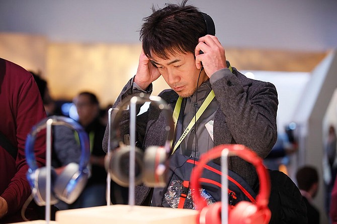 An attendee at CES 2017 listens to high-res audio.