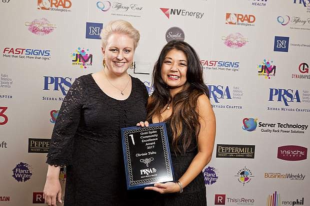 Katie Coleman, left, and Chrisie Yabu,both with KPS3, pose with Yabu&#039;s Gold Spike Community Excellence award at the PRSA Sierra Nevada&#039;s 2017 Silver Spike on Nov. 17 at The Grove.
