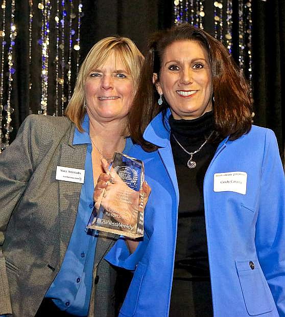 Cindy Carano, right, acceps the award for Most Diverse (Workforce Diversity) from Stacy Asteriadis, relationship manager for City National Bank, at the Jan. 17 gala.