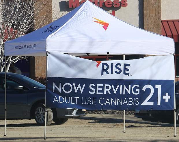 A pop-up tent on Jan. 1 advertises that RISE Carson City can now serve adult cannabis customers.