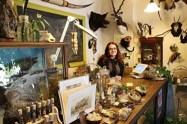 Natural Selection co-owner Emily Felch stands behind the sales counter of her shop in Midtown Reno.