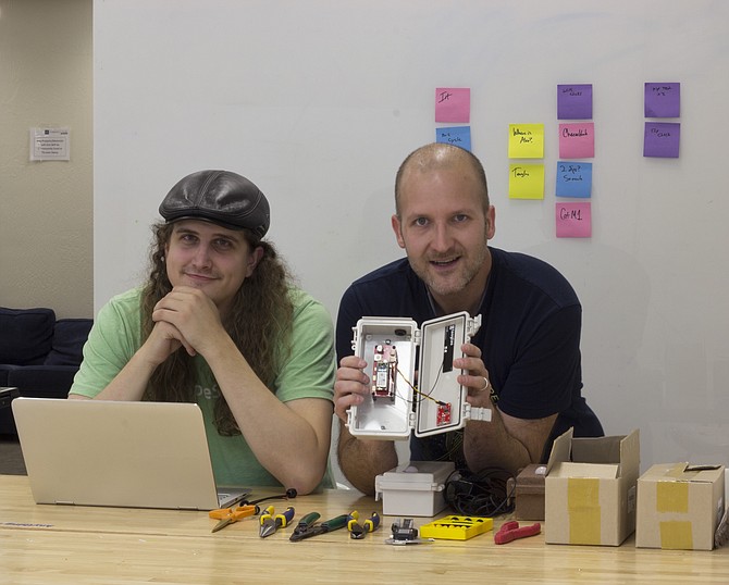 SimpleSense co-founders Mark Lorkowski, left, and Eric Kanagy show a prototype sensor at the University of Nevada, Reno Innevation Center makerspace in Reno.