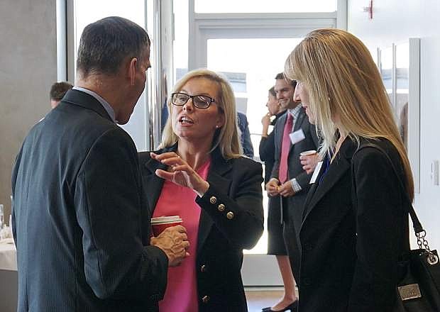 Reno Mayor Hillary Schieve, center, speaks with EDAWN CEO Mike Kazmierski, left, and Reno-Sparks Chamber of Commerce CEO Ann Silver, right, prior to the &quot;Blockchain: Building the New Nevada on Trust&quot; conference at the Nevada Museum of Art on Tuesday, Feb. 6.