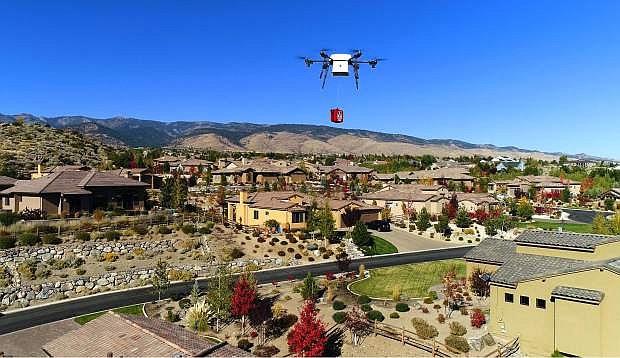 A Flirtey drone flies over a Reno neighborhood to deliver an automated external defibrillator (AED) during an October demonstration of the process. Flirtey is partnering with REMSA in the program, which is waiting for FAA approval.
