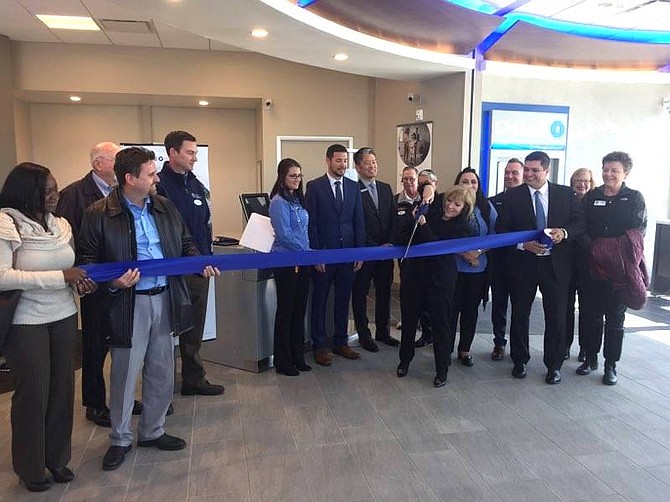 Chase Bank South Meadows branch manager Julie Wood cuts the ribbon on Chase new Reno location on Feb. 27.  She is flanked by Chase managers, employees, and guests.