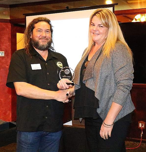Churchill Economic Development Authority Executive Director, Nathan Strong, left, presents a CEDA Lifetime Award to Rachel Dahl, newly appointed Senior Area Manager for Nevada&#039;s Small Business Administration.