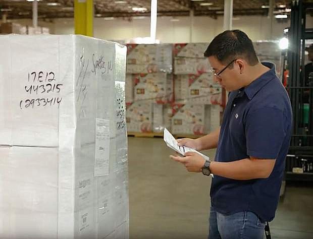 Ronal Guerrero, seen here working at the ITS Logistics facility in Sparks, intends to earn his bachelor&#039;s degree in logistics at Truckee Meadows Community College.