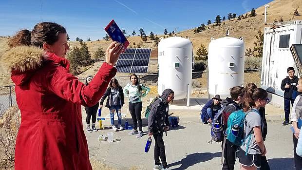 Leah Madison, greenbox coordinator of the division of earth and ecosystem sciences at DRI, explains the purpose of the solar water pump project to the students on the Envirolution Sustainability Tour 2018.