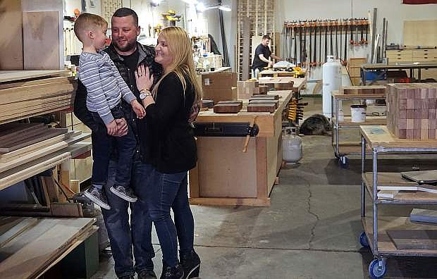 Haus of Reed owners Tim Reed, left, and Randi Reed and their 6-year-old son, Rush, inside of their shop located on Greg Street in Sparks.