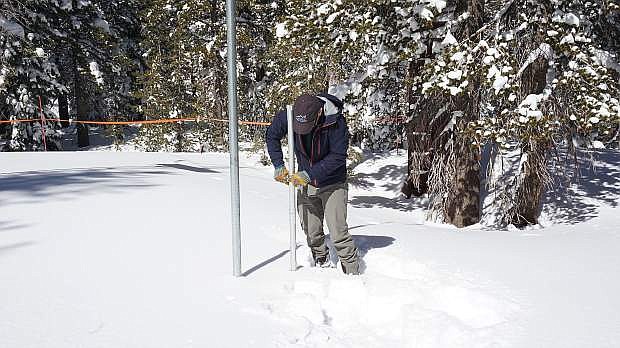Jeff Anderson, hydrologist for the Natural Resources Conservation Service, measures the snowpack on Mt. Rose on Monday.