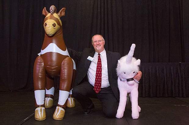 Dave Archer, CEO of NCET, poses April 5 with the &quot;stars&quot; of the 2018 NCET Tech Awards. Archer told the NNBW that annual awards strives to keep the event light and fun with such special guests and other antics.