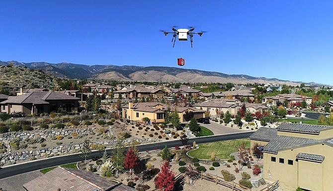 A Flirtey drone flies over a Reno neighborhood to deliver an automated external defibrillator (AED) during an October 2017 demonstration of the process.