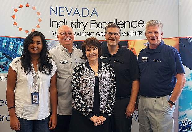 Nevada Industry Excellence members gather at their office at the UNR Innevation Center. Pictured, left to right, are administrative assistant Alisa Kader, project manager Martin Potnick, financial manager Rhonda Hohenstein, director Mark Anderson, and project manager Rhea Gustafson. Not pictured: project manager Stacy Rutherford.