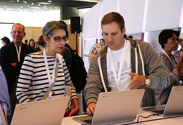 Reno-based social media manager Paige Wadleigh, left, gets assistance from a Googler during the Grow with Google event Monday, Aug. 6, at the Nevada Museum of Art in Reno.