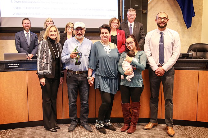 Mario DelaRosa, owner of Ahora Latino Journal, and family members accept the Business Recognition Program award from the Reno City Council on Oct. 24.