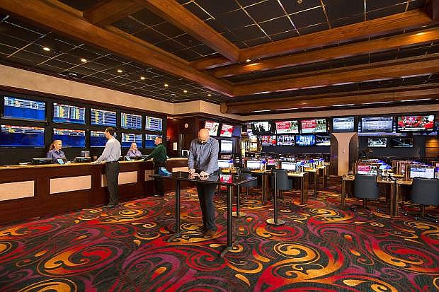 Sports bettors place wagers at the Eldorado Race and Sports Book in downtown Reno.